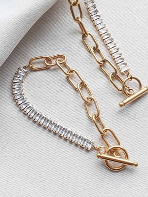 Pozłacana bransoletka z podłużnymi cyrkoniami